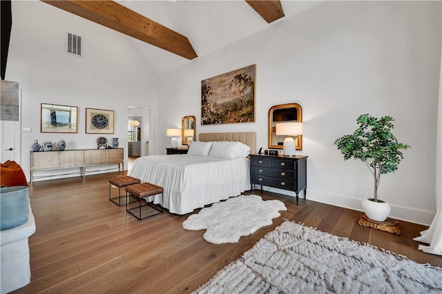 bedroom with high vaulted ceiling, dark hardwood / wood-style floors, and beam ceiling