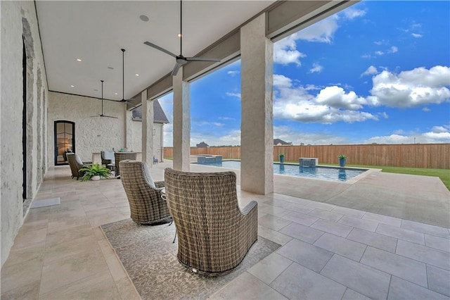 view of patio with a fenced in pool, pool water feature, and ceiling fan