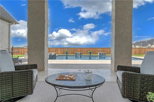 view of patio / terrace with a fenced in pool and pool water feature