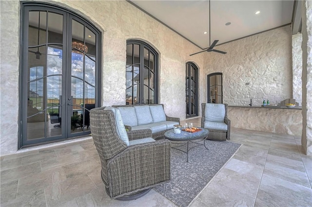 view of patio featuring french doors, ceiling fan, and an outdoor living space