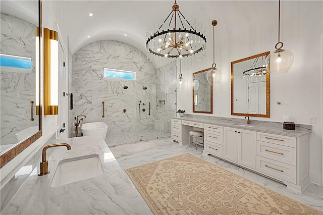 bathroom featuring vanity, vaulted ceiling, and independent shower and bath