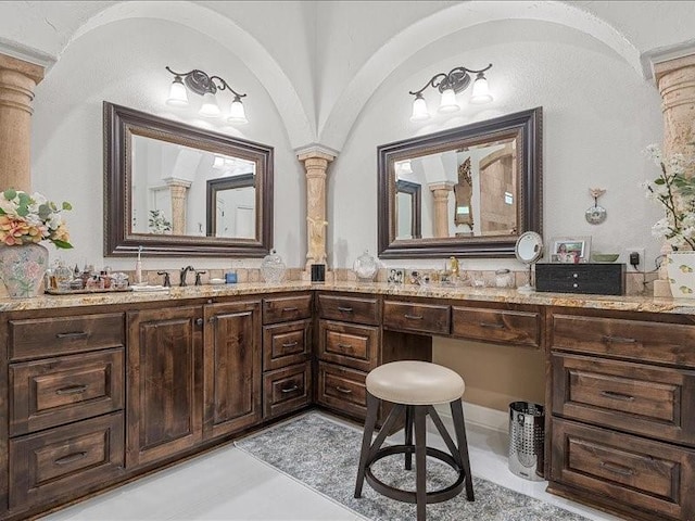 bathroom featuring vanity, decorative columns, and tile patterned floors