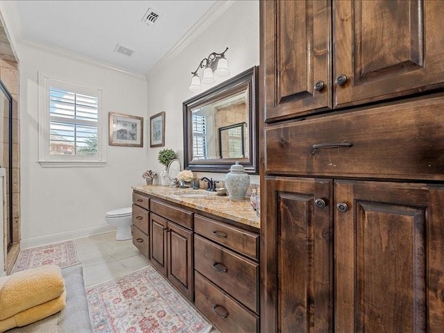 bathroom with toilet, plenty of natural light, vanity, and ornamental molding