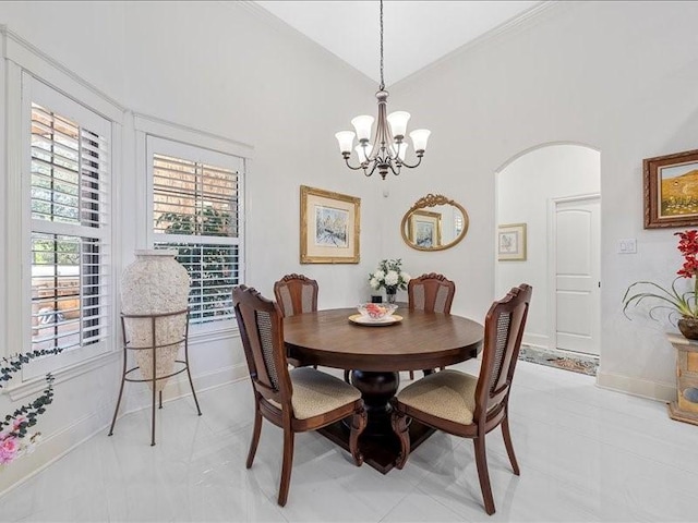 dining area featuring vaulted ceiling and a notable chandelier