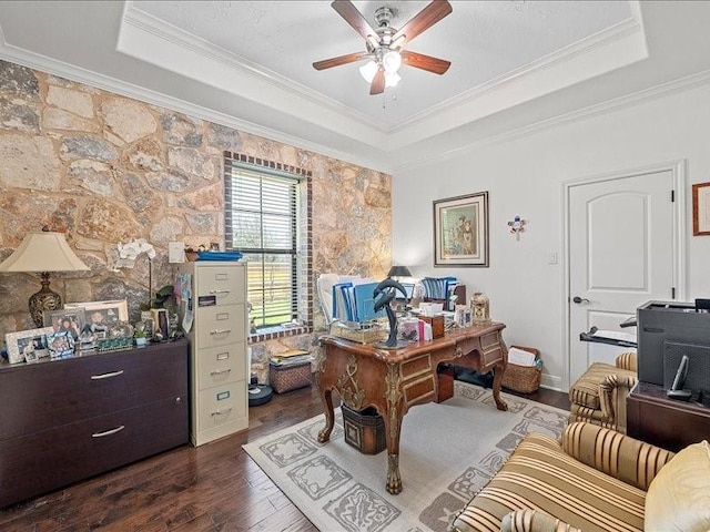 office area with a tray ceiling, crown molding, ceiling fan, and dark hardwood / wood-style floors