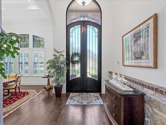 foyer entrance featuring french doors and hardwood / wood-style flooring