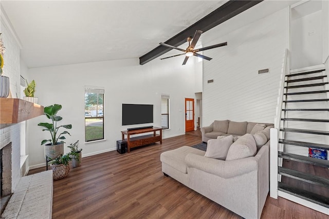 living room with beam ceiling, high vaulted ceiling, a brick fireplace, and dark wood-type flooring