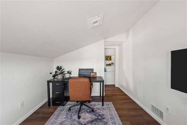 office featuring built in shelves, lofted ceiling, and dark wood-type flooring