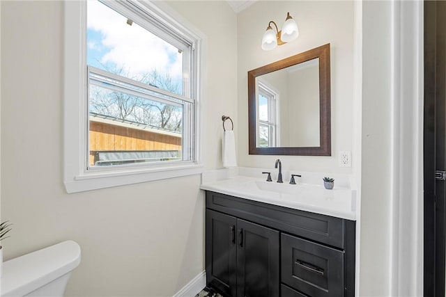 bathroom featuring vanity and toilet