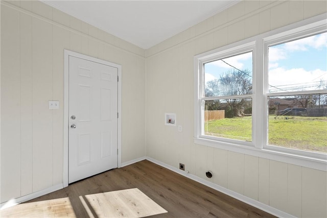 clothes washing area with dark hardwood / wood-style flooring, hookup for a washing machine, plenty of natural light, and hookup for an electric dryer