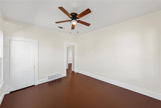 unfurnished bedroom with ceiling fan and dark hardwood / wood-style floors