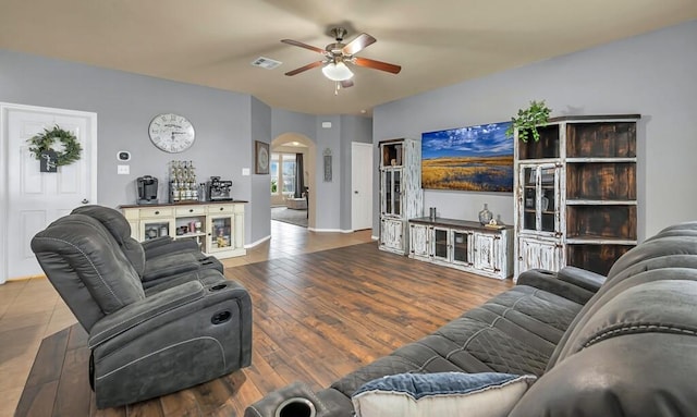 living room with hardwood / wood-style floors and ceiling fan