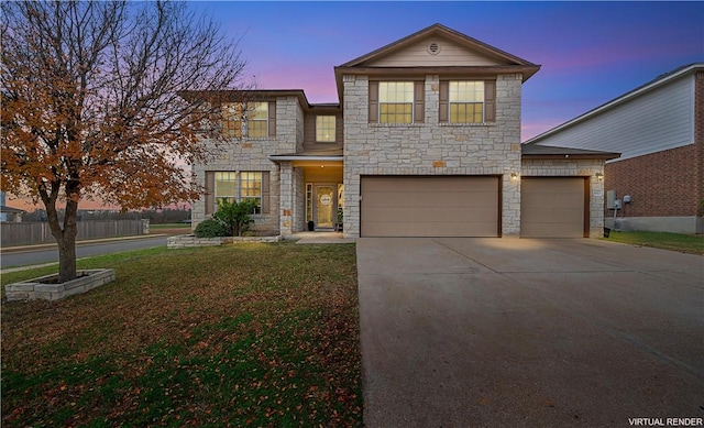 view of front of house featuring a lawn and a garage