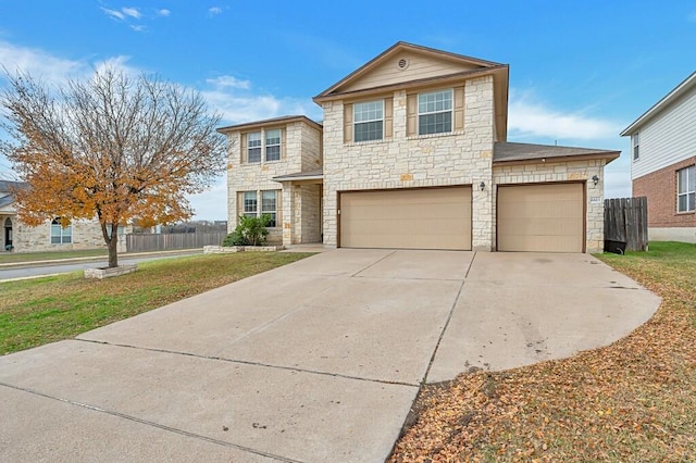 view of front property featuring a front yard and a garage