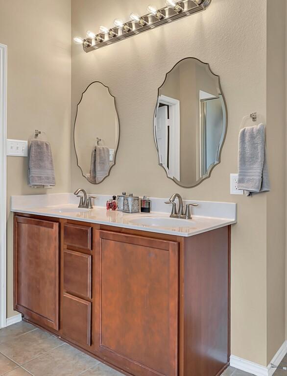 bathroom with vanity and tile patterned floors