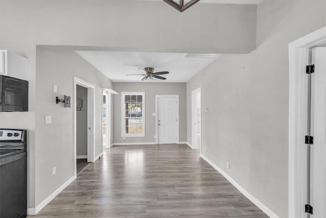 entryway with wood-type flooring and ceiling fan