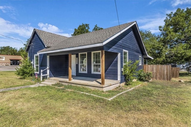 view of front of home featuring a front yard and a porch