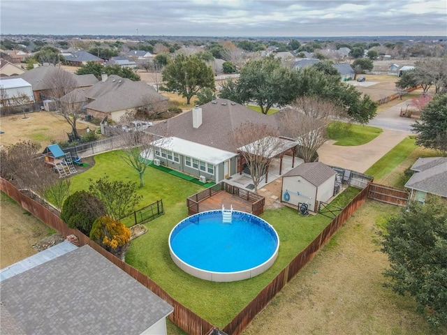 view of swimming pool featuring a lawn