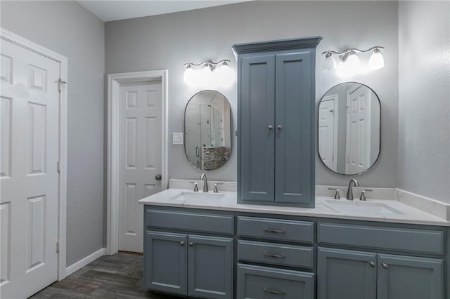 bathroom with vanity and hardwood / wood-style floors