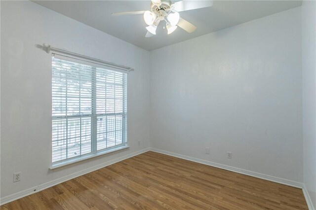 empty room featuring wood-type flooring and ceiling fan