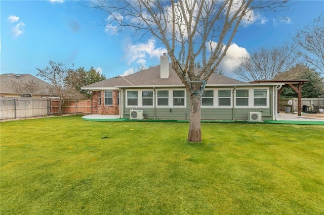 back of property featuring a yard, a patio area, and ac unit