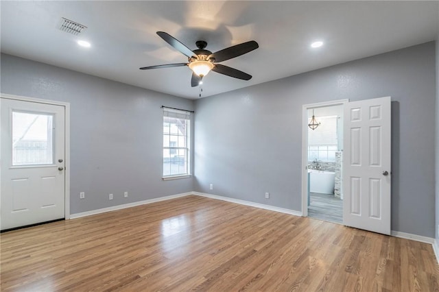 interior space with ceiling fan and light hardwood / wood-style flooring