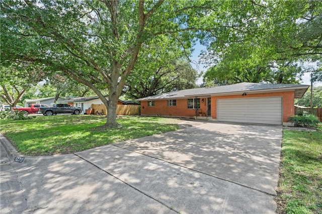 ranch-style home with a garage and a front lawn