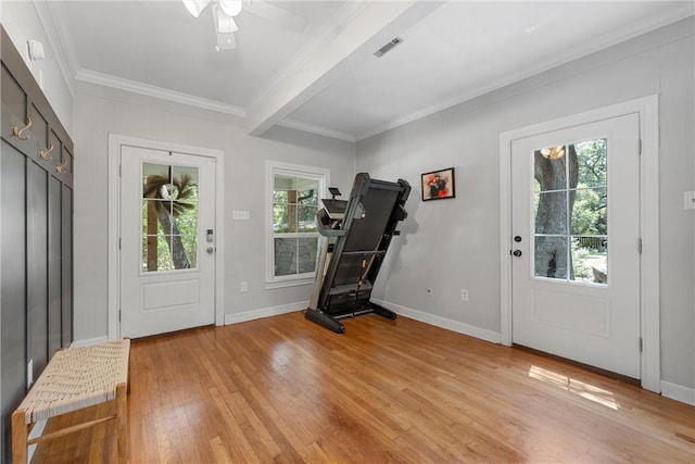 entrance foyer with beam ceiling, ceiling fan, light hardwood / wood-style flooring, and ornamental molding