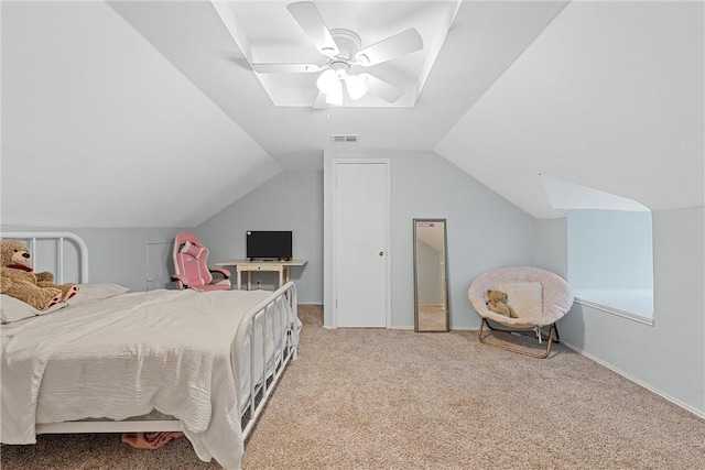 bedroom with carpet floors, vaulted ceiling, and ceiling fan