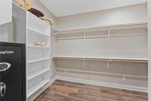 spacious closet featuring hardwood / wood-style flooring