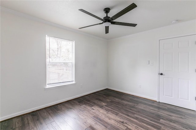 spare room with ceiling fan, ornamental molding, and dark wood-type flooring