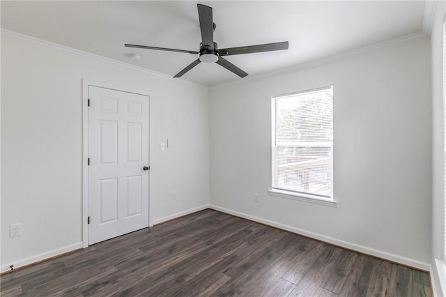 spare room featuring dark hardwood / wood-style floors, ceiling fan, and crown molding