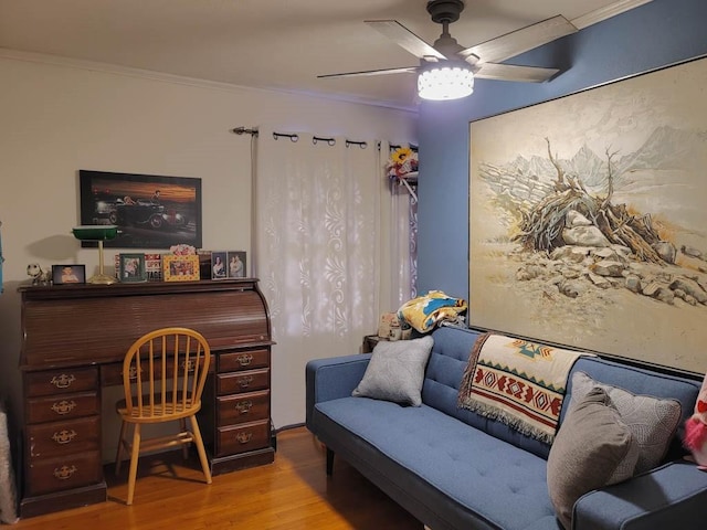 home office with ceiling fan, light wood-type flooring, and crown molding