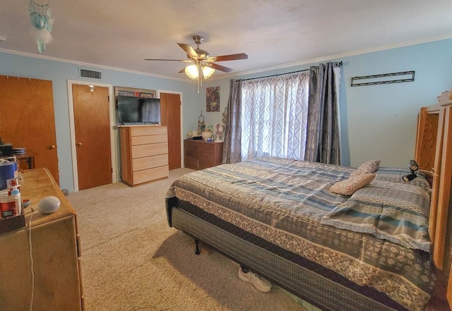 bedroom with ceiling fan, light colored carpet, and ornamental molding