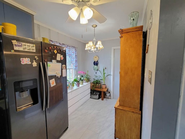 kitchen featuring stainless steel fridge with ice dispenser, crown molding, and ceiling fan with notable chandelier