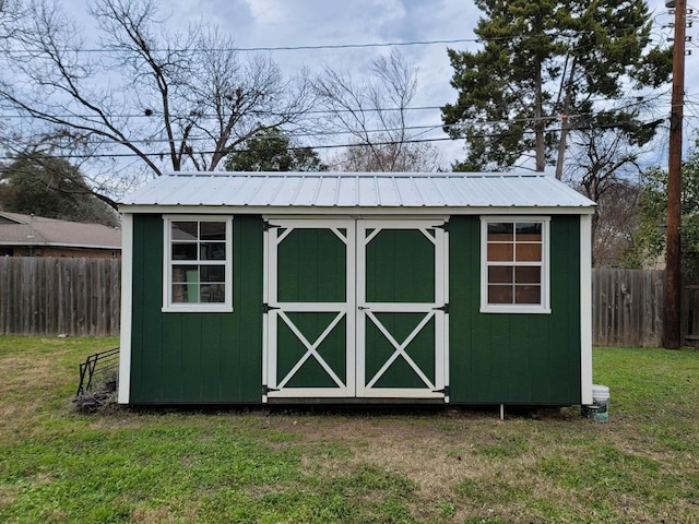 view of outdoor structure featuring a yard