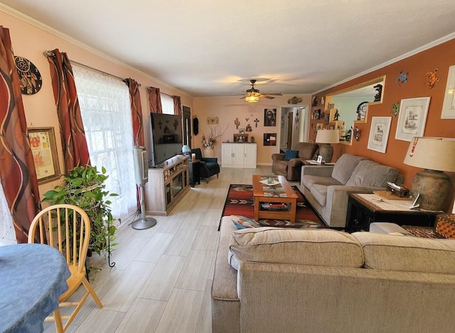 living room featuring ceiling fan, light hardwood / wood-style floors, and ornamental molding