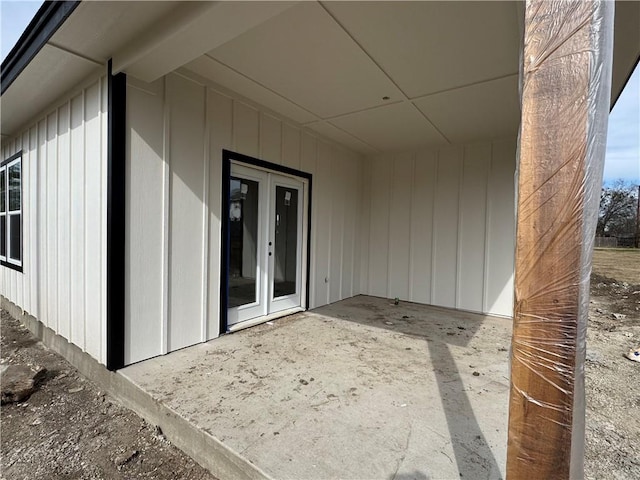 entrance to property with a patio area and french doors