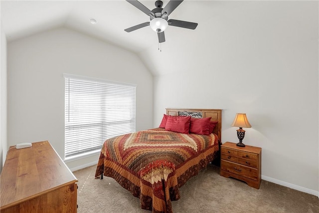 bedroom featuring ceiling fan, light carpet, and vaulted ceiling