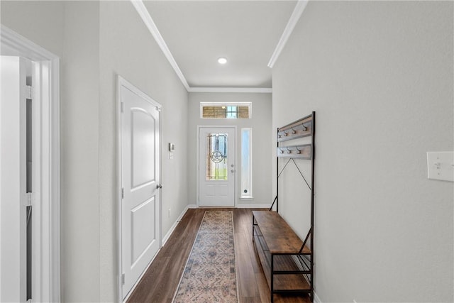 entryway with dark hardwood / wood-style floors and ornamental molding