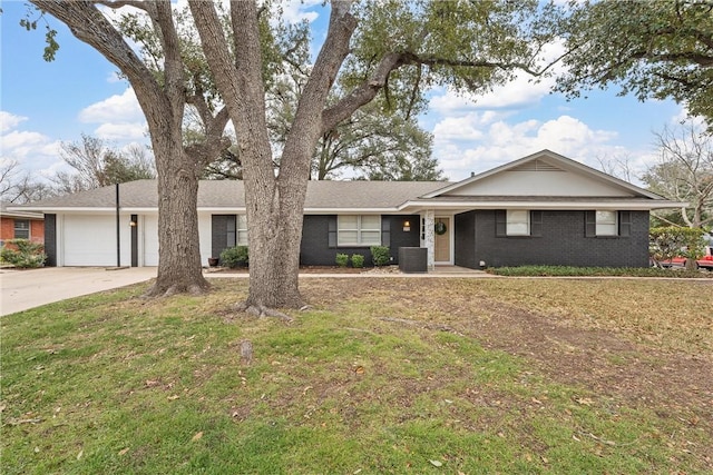 ranch-style home featuring an attached garage, central air condition unit, brick siding, concrete driveway, and a front lawn