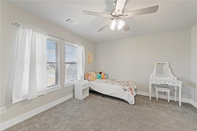 bedroom featuring ceiling fan and light colored carpet