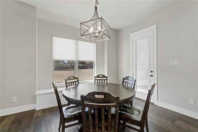 dining space with an inviting chandelier and dark wood-type flooring