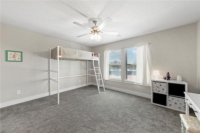 unfurnished bedroom featuring ceiling fan and carpet floors