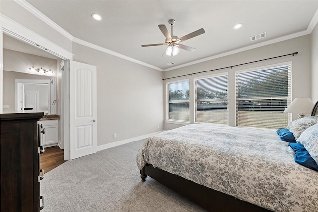 bedroom featuring dark colored carpet, ceiling fan, and crown molding