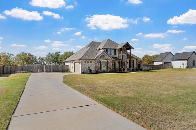 view of front facade with a garage and a front lawn