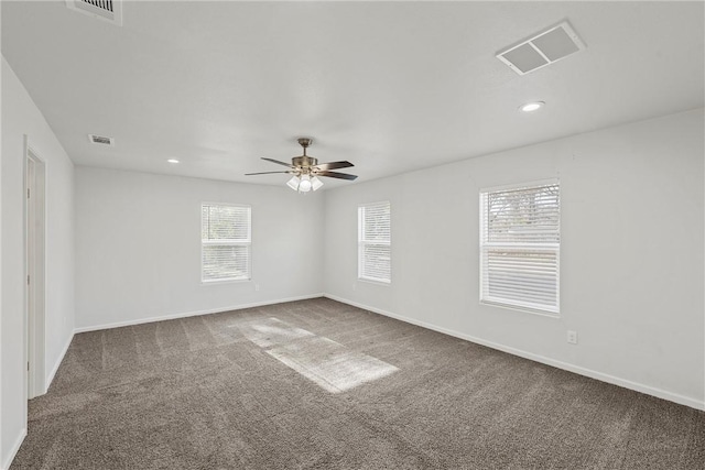 carpeted empty room featuring ceiling fan