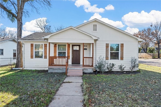 bungalow-style house featuring a porch and a front lawn