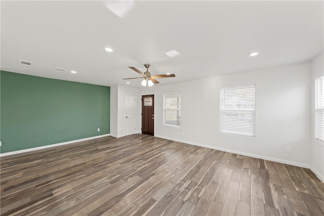 unfurnished room with ceiling fan and dark hardwood / wood-style floors