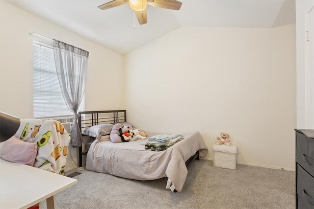 carpeted bedroom featuring ceiling fan and vaulted ceiling